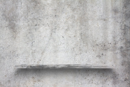 empty shelf on concrete wall