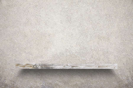 empty shelf on concrete wallの写真素材