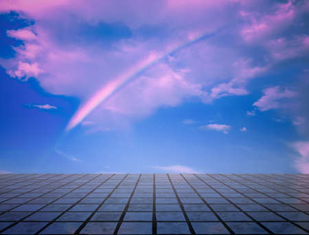 pink clouds, blue sky, gray floor. neon dramatic background.の写真素材