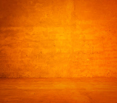 empty orange interior with concrete wall, plaster backgroundの写真素材