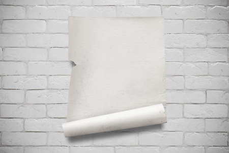 old paper on white brick wall