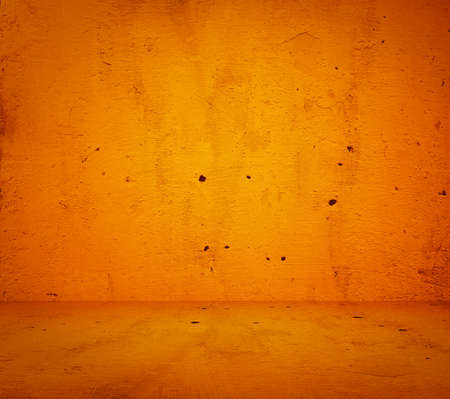 empty orange interior with concrete wall, plaster backgroundの写真素材