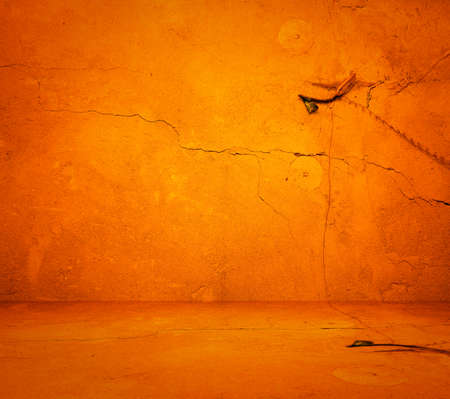 empty orange interior with concrete wall, plaster backgroundの写真素材