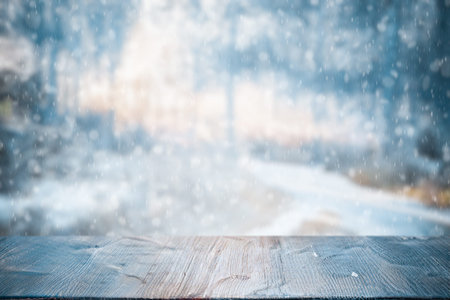 Old frozen wooden table and snowy forest. Christmas and new year winter background.
