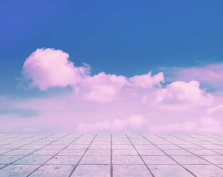 pink clouds, blue sky, gray floor. neon dramatic background.の写真素材