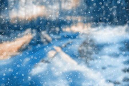 blurred winter forest, falling snow bokeh