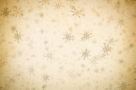 christmas vintage background with snowflakes on old paper textureの写真素材