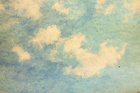 retro sky painting pattern on old paper texture. vintage watercolor clouds.の写真素材