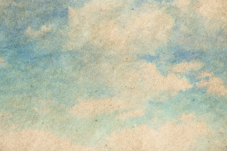 retro sky painting pattern on old paper texture. vintage watercolor clouds.の写真素材