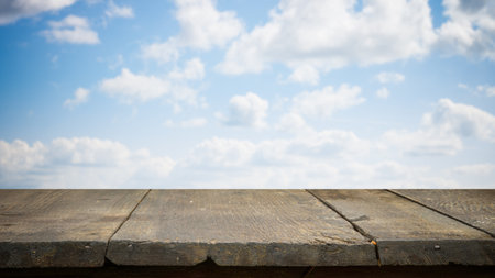 brown wooden table, beautiful blue sky. background.の写真素材