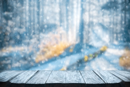 Old frozen wooden table and snowy forest. Christmas and new year winter background.の写真素材