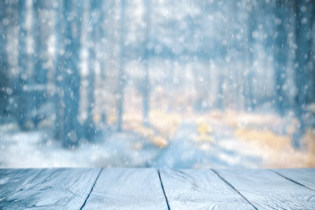 Old frozen wooden table and snowy forest. Christmas and new year winter background.の写真素材