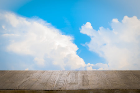 brown wooden table, beautiful blue sky. background.の写真素材