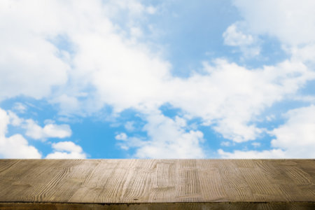 brown wooden table, beautiful blue sky. background.の写真素材