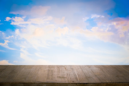 brown wooden table, beautiful blue sky. background.の写真素材