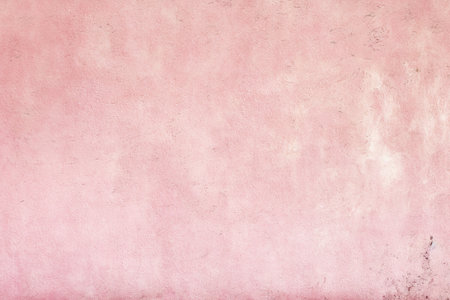 old pink concrete background, grungy plaster wallの写真素材