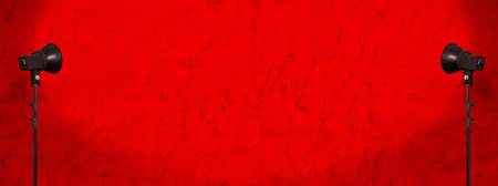 lighting studio equipment, color concrete background, red plaster wall, banner sizeの写真素材