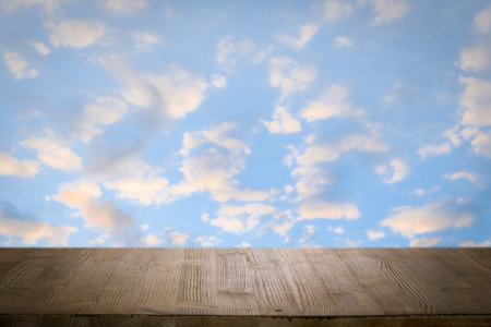 brown wooden table, beautiful blue sky. background.の写真素材