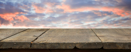 brown wooden table, beautiful blue sky. background.の写真素材