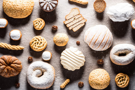 Various fresh and tasty bakery products. Top view close up home made buns and cookies concept. pastry food collection. Flat lay composition. AI generative image.の素材