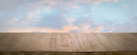 brown wooden table, beautiful blue sky. background.の写真素材