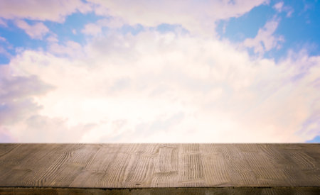 brown wooden table, beautiful blue sky. background.の写真素材