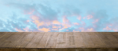 brown wooden table, beautiful blue sky. background.の写真素材