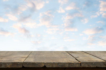 brown wooden table, beautiful blue sky. background.の写真素材