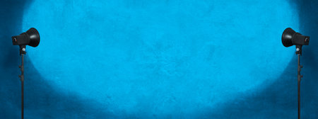 lighting studio equipment, color concrete background, blue plaster wall, banner sizeの写真素材