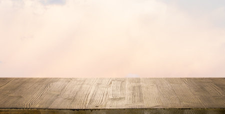 brown wooden table, beautiful blue sky. background.の写真素材