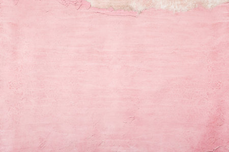 old pink concrete background, grungy plaster wallの写真素材