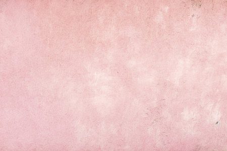 old pink concrete background, grungy plaster wallの写真素材