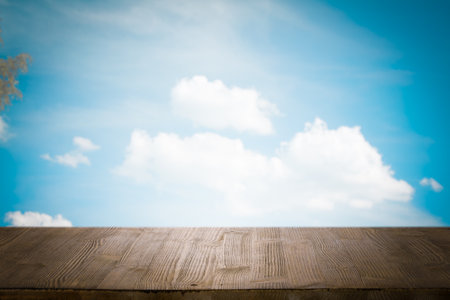 brown wooden table, beautiful blue sky. background.の写真素材