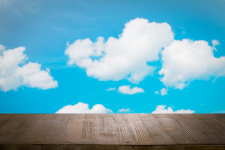 brown wooden table, beautiful blue sky. background.の写真素材