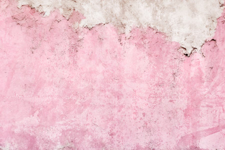 old pink concrete background, grungy plaster wallの写真素材