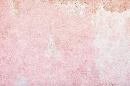 old pink concrete background, grungy plaster wallの写真素材