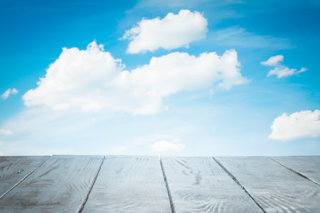 white wooden table, beautiful blue sky. background.の写真素材