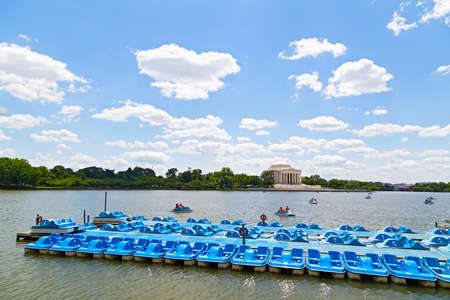 Blue paddle boats  Tourists enjoy boating in Tidal Basin with Jefferson Memorial seen in the background  のeditorial素材