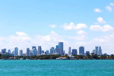 Cloudy sky over the water and Miami city, Florida  A view on Miami city skyline from Miami Beach waterfront  の写真素材