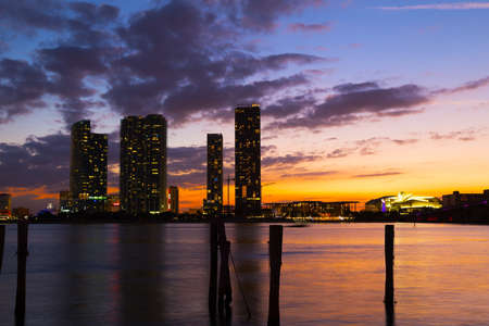 Dramatic sunset over Miami city downtown  Urban landscape and calm waters at sunset の写真素材