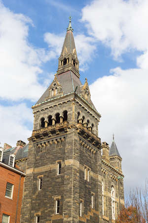 South tower of historic Healy Hall building of Georgetown University in Washington DC. Neo-Medieval style of Healy Hall tower in fall.のeditorial素材
