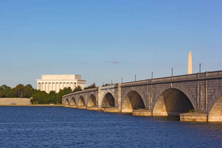 Arlington Memorial Bridge, Lincoln Memorial and National Monument in Washington DC, USA. A view on the bridge and Lincoln Memorial from Arlington side during sunset.の写真素材