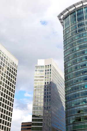 Windows geometry of city skyscrapers. Buildings located in close proximity with shadows and...