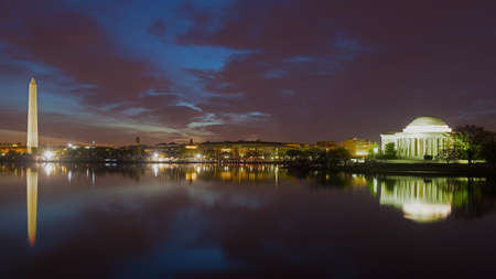 Washington Monument and Jefferson Memorial at night with the city skyline. Colorful reflections of Washington landmarks in the Tidal Basin.のeditorial素材