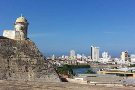 A view on the old walled city of Cartagena from atop of San Filipe de Barajas Castle, Colombia. Cartagena old city surrounded by water on a sunny morning.のeditorial素材