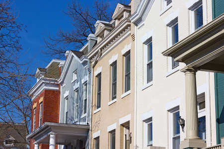 Residential row houses in US Capital on a spring morning. Colorful brick townhouses of Washington DC.の写真素材