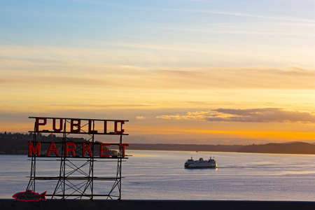 SEATTLE, USA Ã¢ï¿½ï¿½ MARCH 25, 2016: Sunset over Puget Sound in Seattle on March 25, 2016. Pike Public Market neon sign at sunset.のeditorial素材