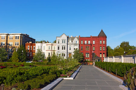 Residential architecture of North East surburb of Washington DC. Colorful row houses surronded by garden.の写真素材