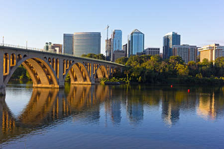 Key Bridge and Rosslyn skyline in early morning, Washington DC, USA. A view n Potomac River from Georgetown Park in US capital.の写真素材