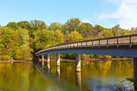 Footbridge bridge to the Theodore Roosevelt Island in Washington DC, USA. Kayaking on Potomac River in early autumn.の写真素材